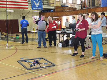 student flying copter